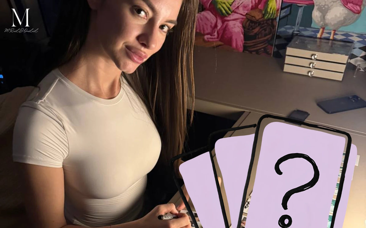 Creator signing MRLDOLL collaboration artwork