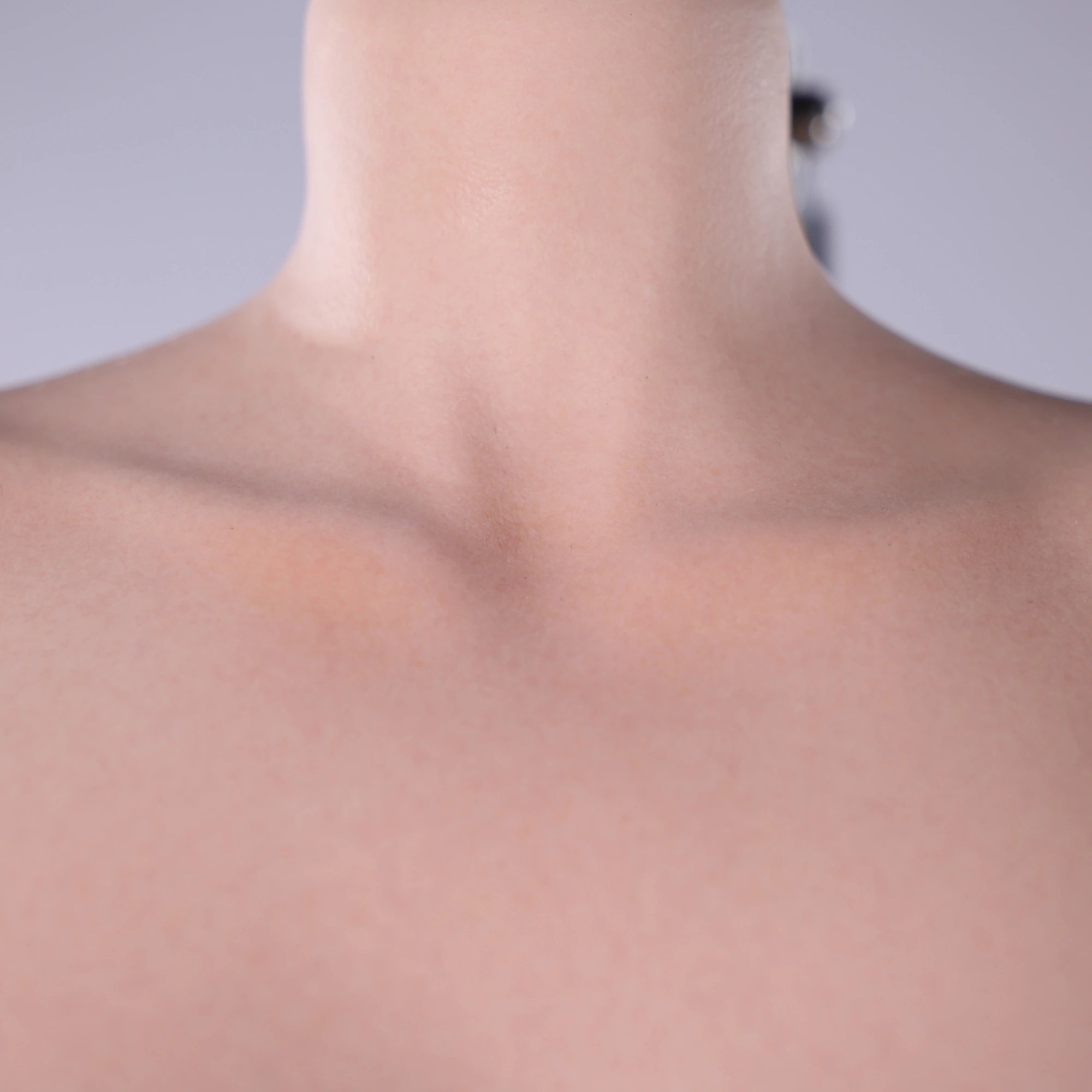 Image of bbw sex doll Lana close up of clavicle showing realistic skin texture and detailed silicone surface