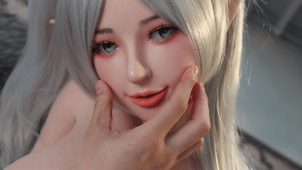 Image of Hand gently pressing Elven’s platinum silicone cheek in a close-up view