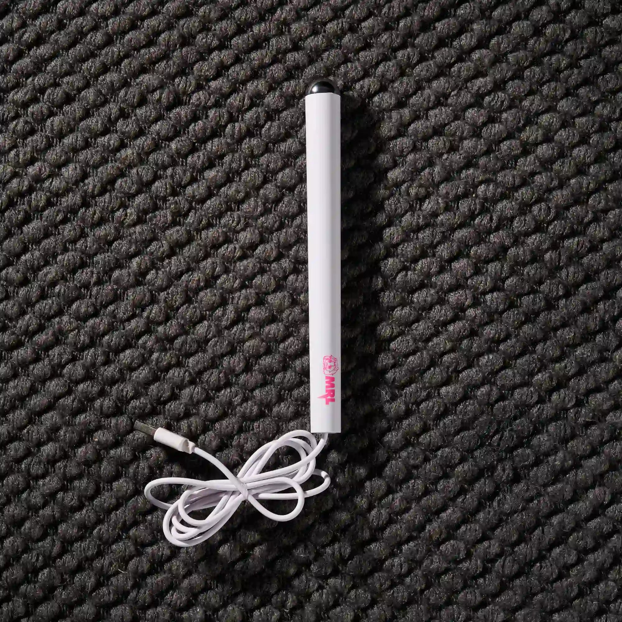 Image of Flat lay of MRLDOLL silicone doll heating rod showing USB port, power switch, and full rod design for maintenance and warming