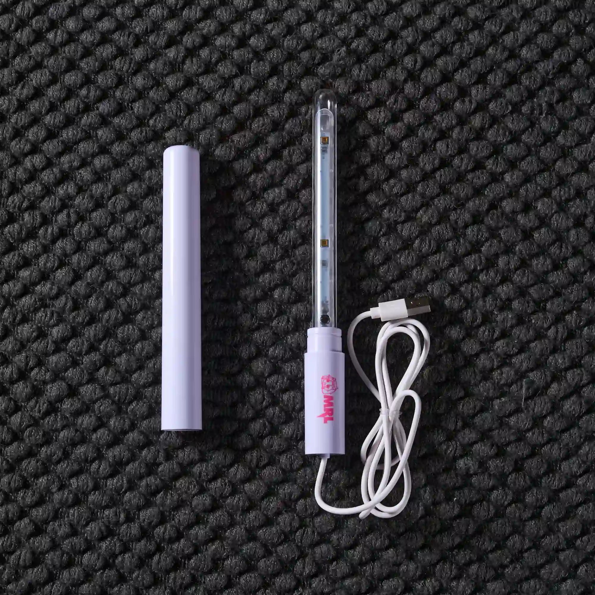 Image of Flat lay of MRLDOLL silicone doll UV sterilization rod with all components displayed, showing internal structure and accessory layout for maintenance