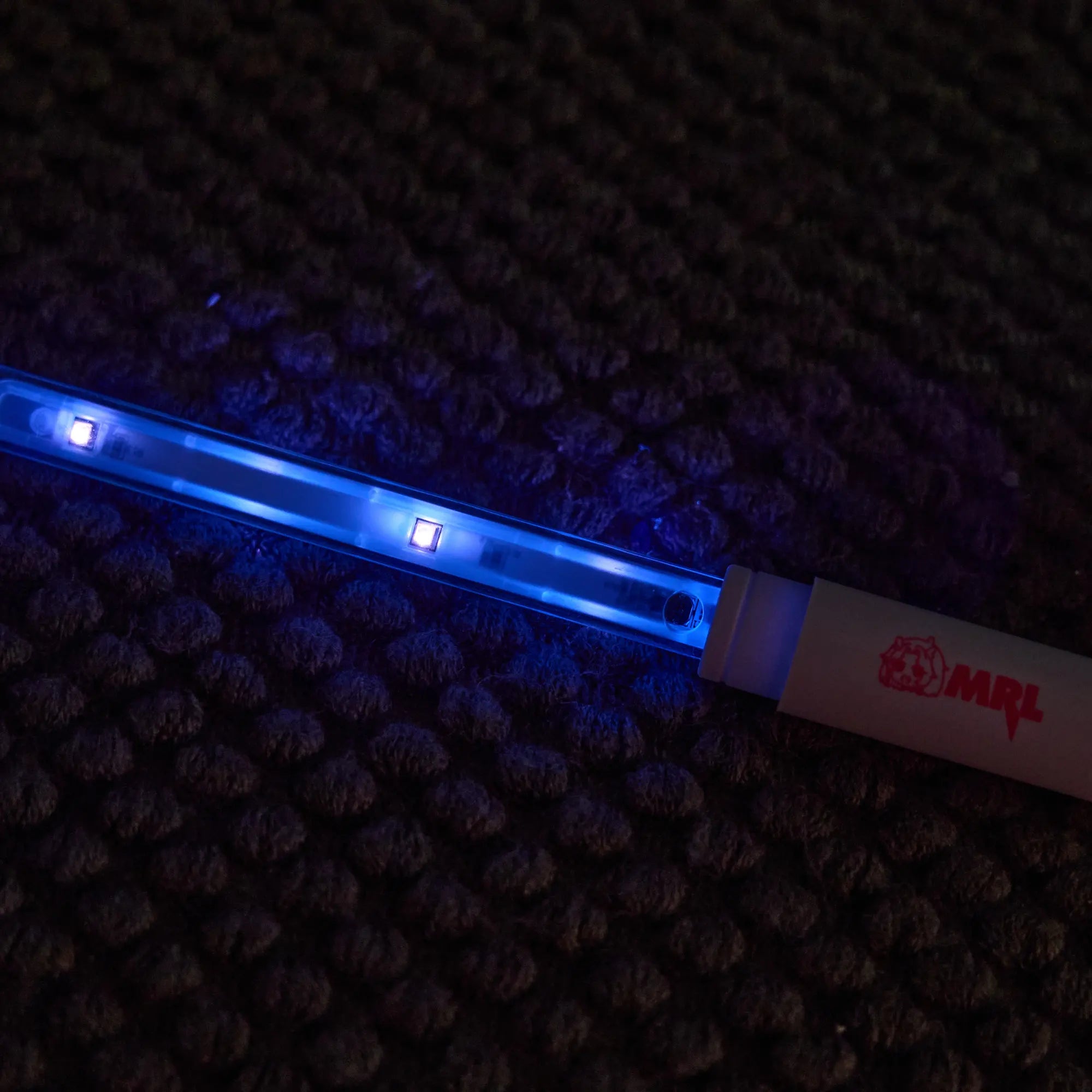 Image of Close-up of MRLDOLL silicone doll UV sterilization rod LED indicator lit while plugged in, showing active sterilization