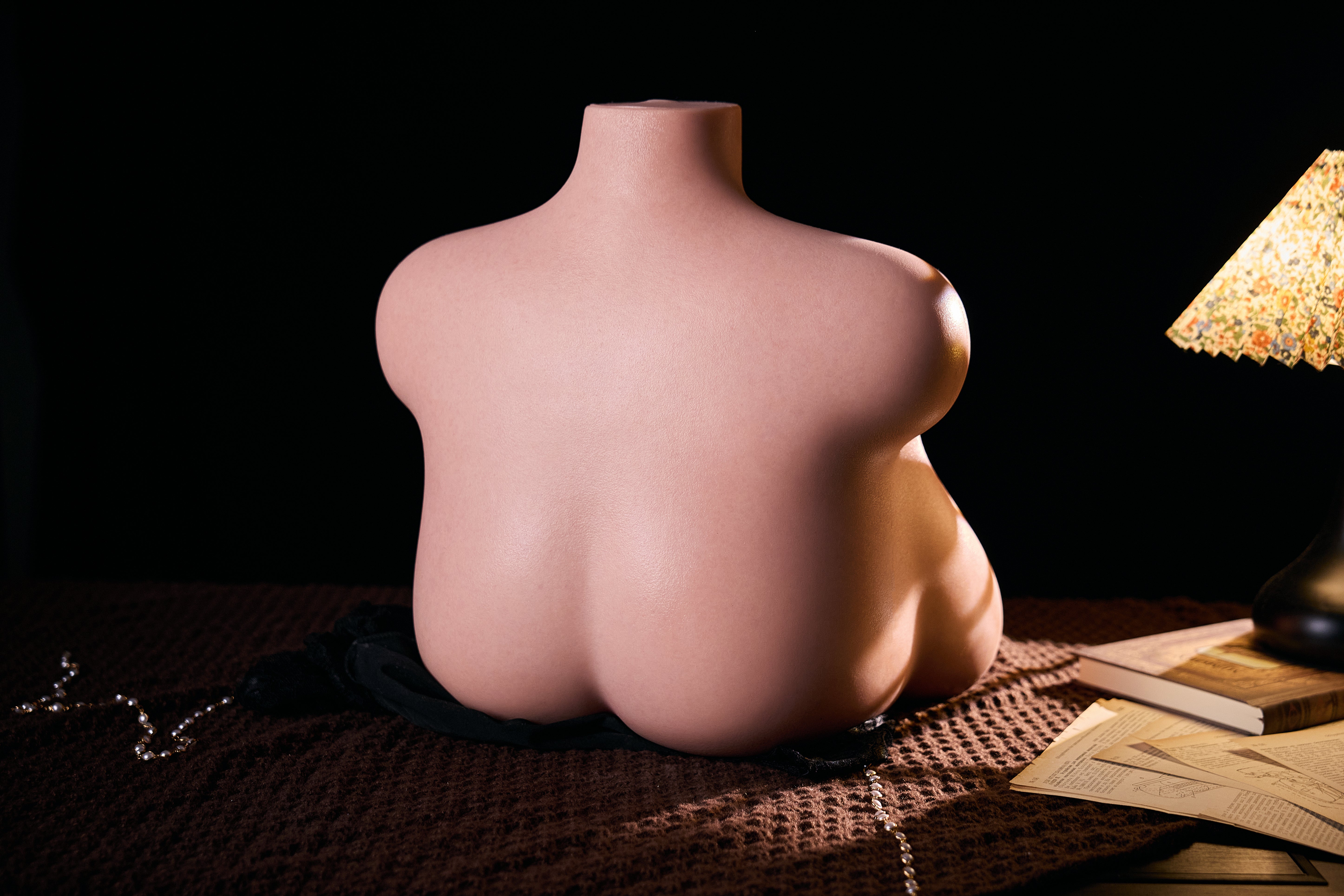 Image of Rear-side view of MRLDOLL Tess torso with light highlighting the delicate, glossy skin texture and natural body curves